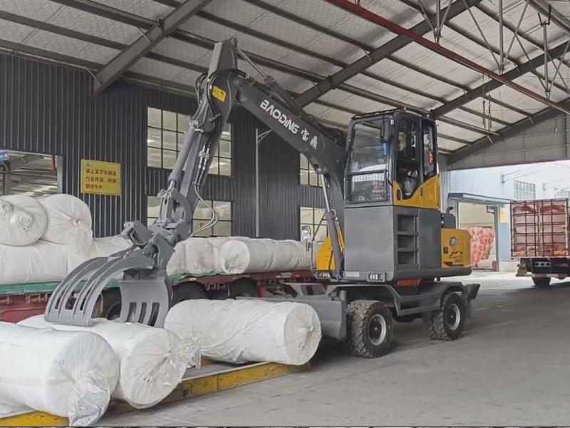 定制升降驾驶室，宝鼎95-9GS抓包机助力工厂物料搬运